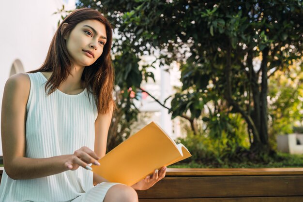 Young woman reading a book.