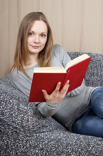 Young woman reading a book