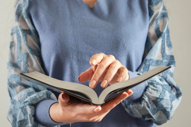 Young woman reading Holy Bible