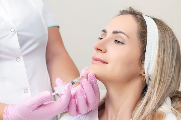 Young woman receiving cosmetic injection