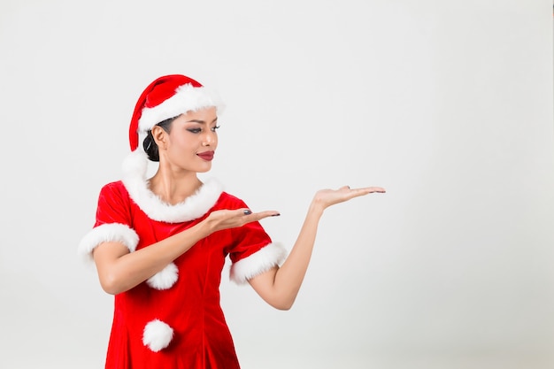 Young woman in red santa claus. Isolated on a White Background.