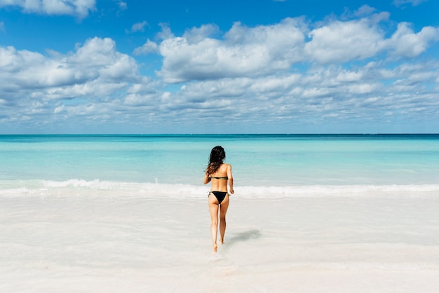 Young woman relax on the beach. Holidays Concept.