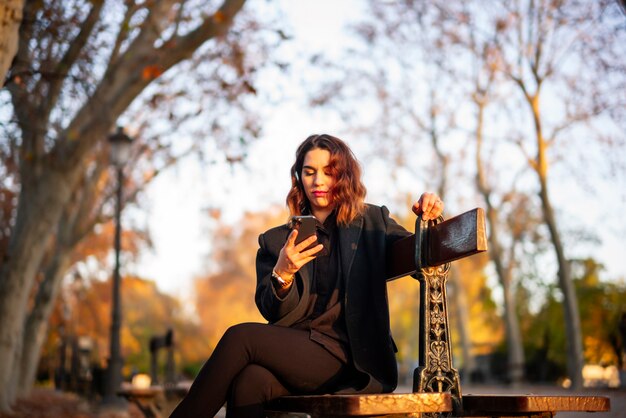 Young woman relaxing in the autumn park