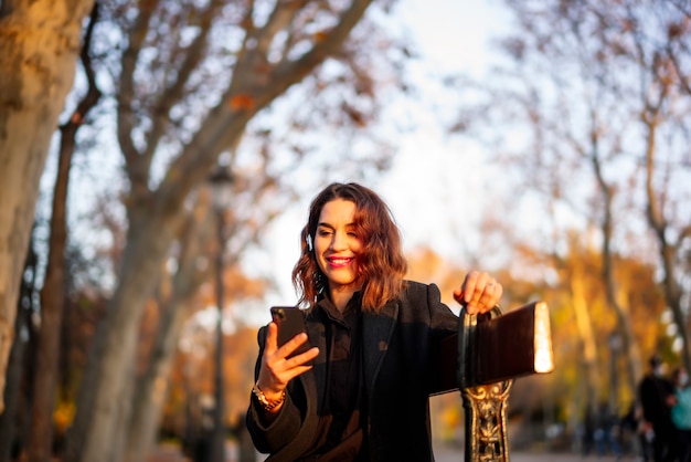 Young woman relaxing in the autumn park