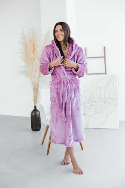 Photo young woman relaxing in bathrobe and spa towel after having bath shower treatment rest and body care