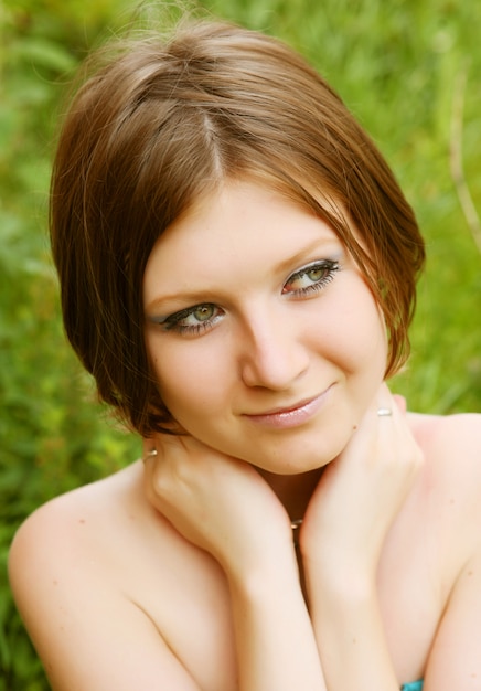 Young woman relaxing in the grass 