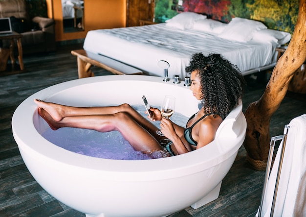 Young woman relaxing in the hydro massage bath