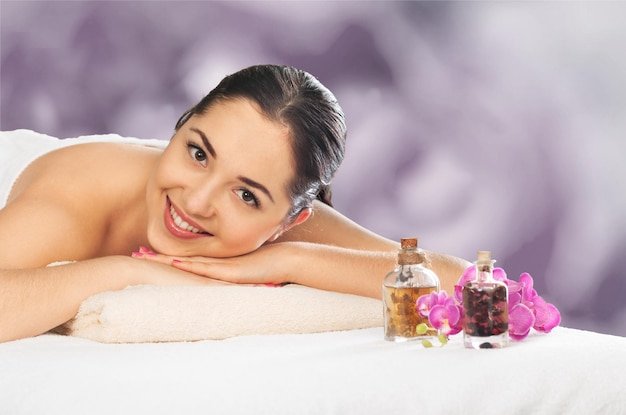 Young woman relaxing in spa salon