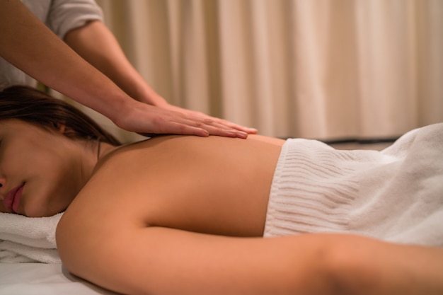 young woman relaxing at the spa
