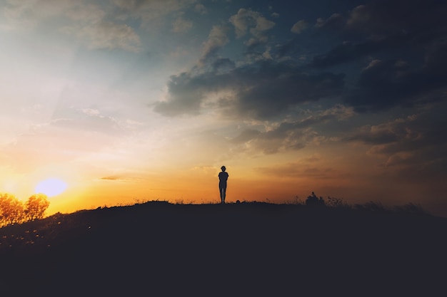 Young woman relaxing in summer sunset sky outdoor. People freedom style.