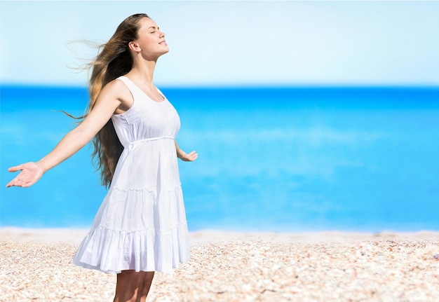 Young woman relaxing on vacation on beach