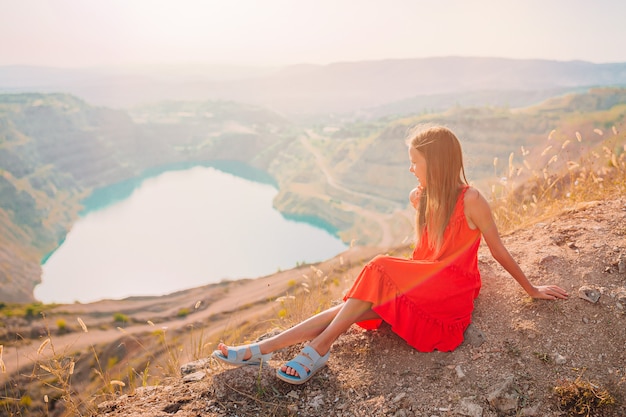 Young woman relaxing with a view of mountains