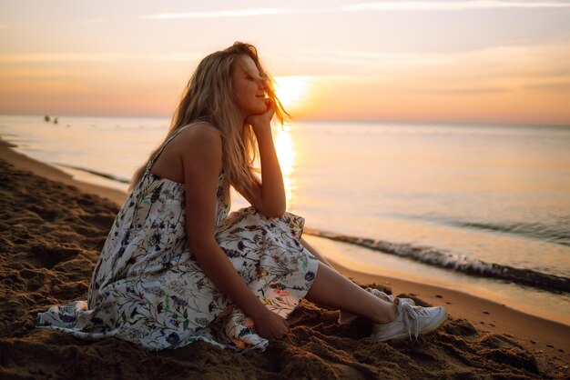 Young woman resting in nature People lifestyle relaxation and vacations concept Fashion