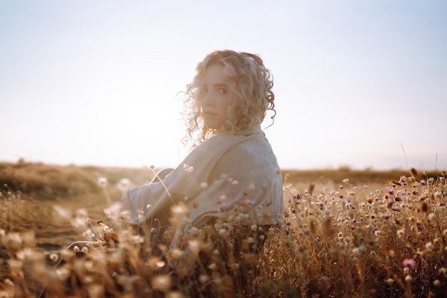 Young woman resting in nature People lifestyle relaxation and vacations concept Fashion