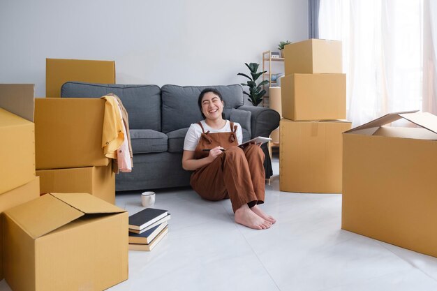 Young woman resting while moving into new home