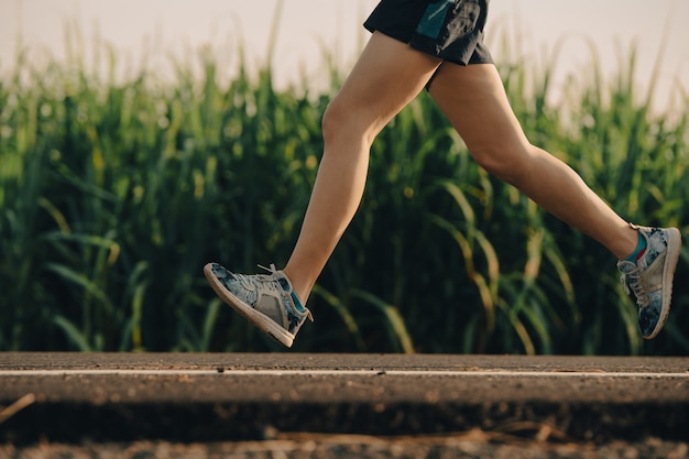 Young woman runner athlete on the road to healthy, Young people running exercise on street