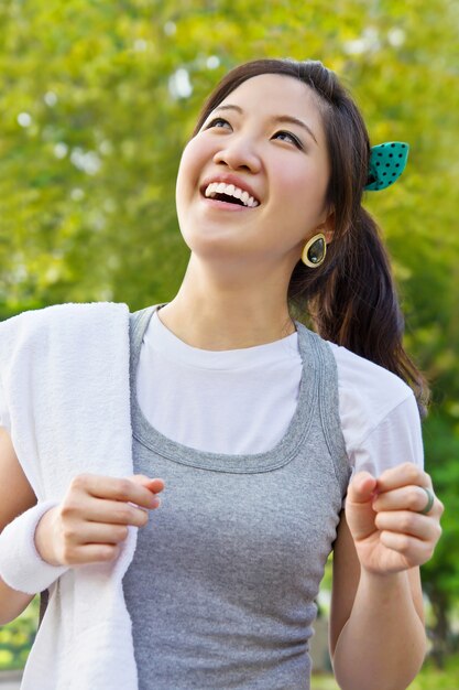 Young woman running in the garden