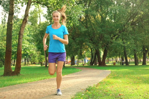 Young woman running in park