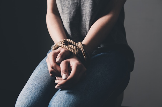 Young woman's hands are tied