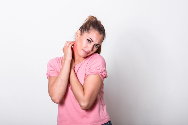 Young woman scratching bitten, red, swollen neck skin from mosquito bites