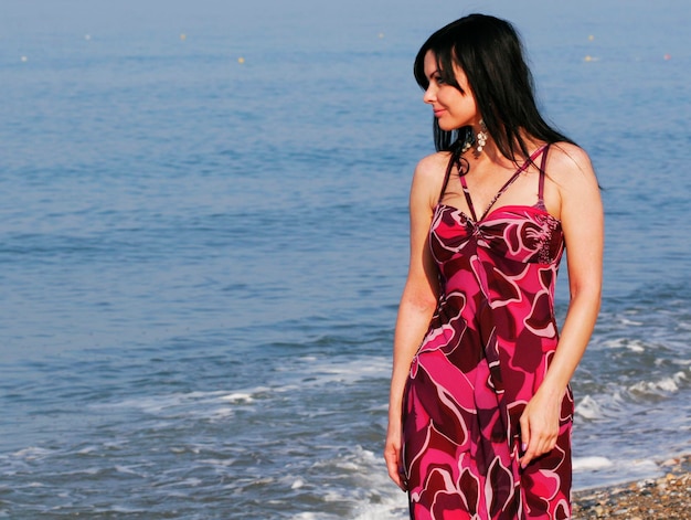 Young woman on the sea in summer