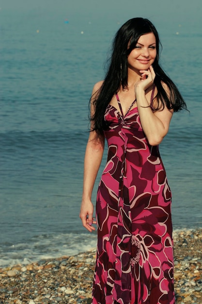 Young woman on the sea in summer