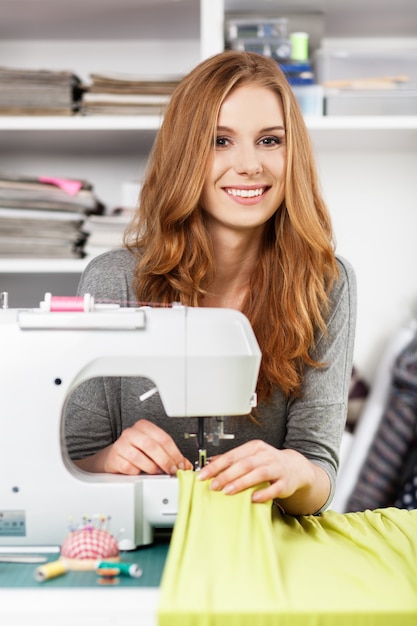 Young woman at a sewing machine