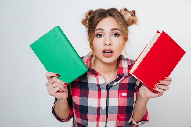 Young Woman in shirt choosing between the books