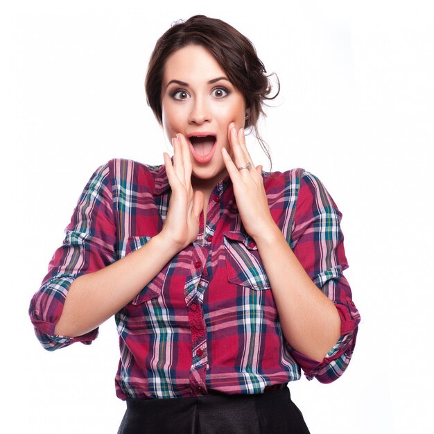 Young woman shout and scream using her hands as tube, studio shoot isolated on white