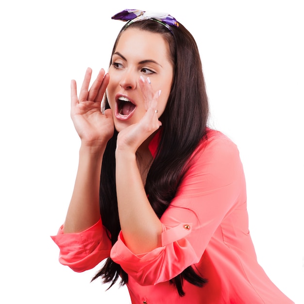 Young woman shout and scream using her hands as tube,