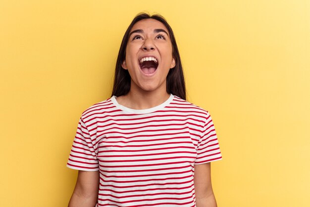 Young woman shouting very angry, rage concept, frustrated.