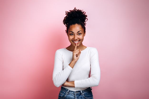 Young woman showing silence sign