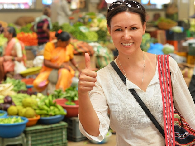 Young woman showing thumb up