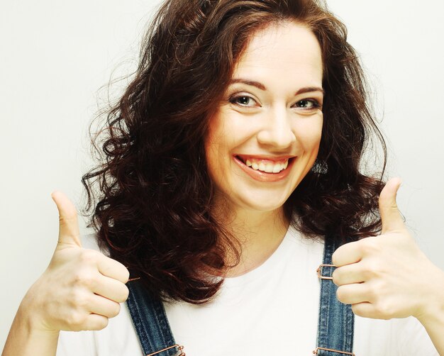 Young woman showing thumbs up gesture