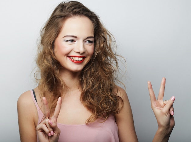 Young woman showing thumbs up gesture