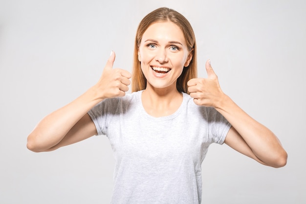 Young woman showing thumbs up