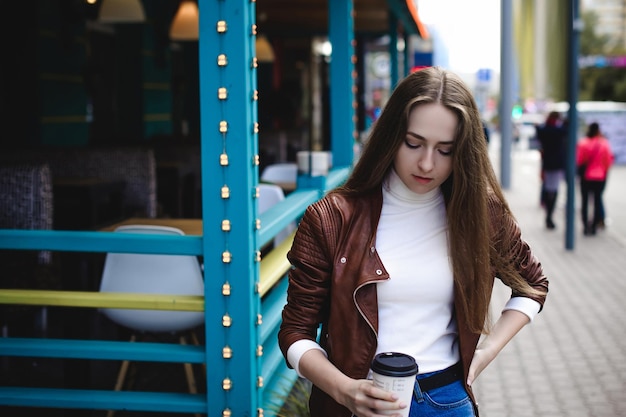 young woman at sidewalk cafe
