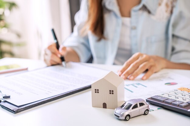 Young woman signing a loan agreement