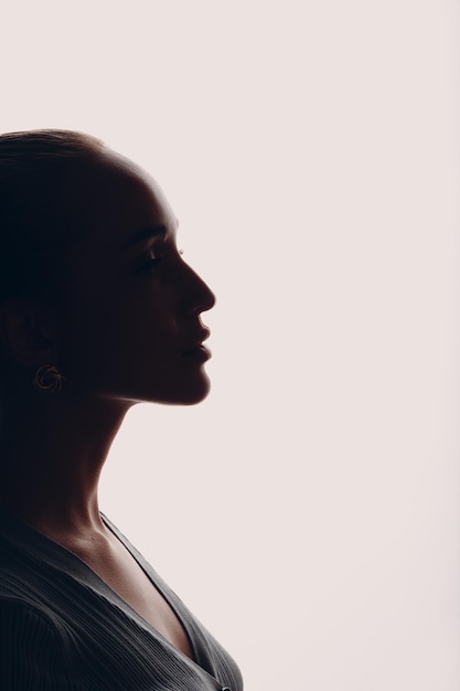 Young woman silhouette profile portrait isolated