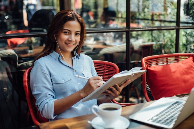 young woman sitting at cafe