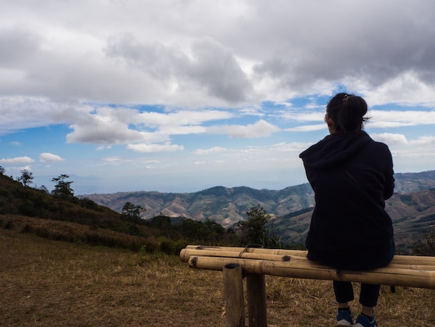 Young woman sitting on chair and see sky,sit  alone