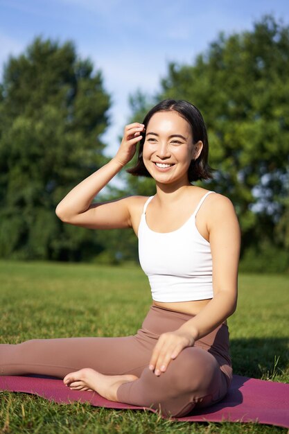 Young woman sitting on field