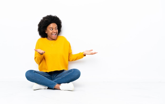 Young woman sitting on the floor