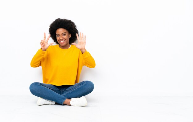 Young woman sitting on the floor