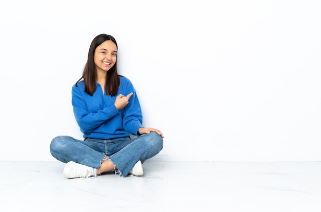 Young woman sitting on the floor