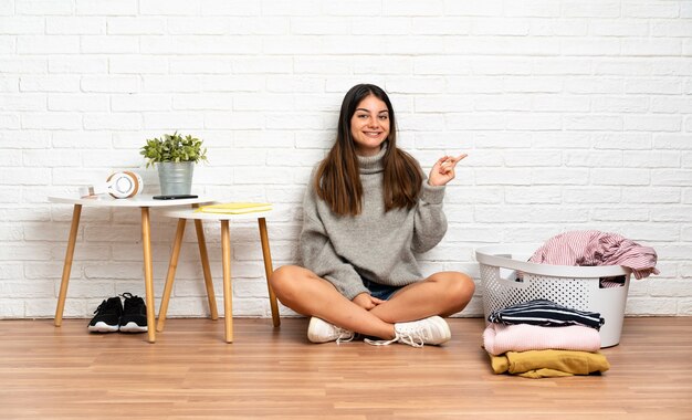 Young woman sitting on the floor