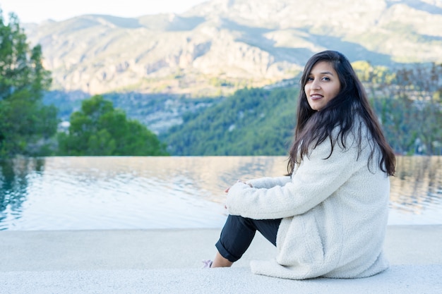 Young woman sitting in the nature