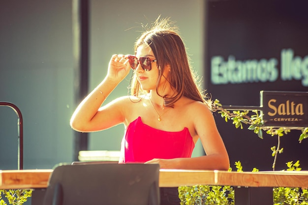 Young woman sitting in a shopping center