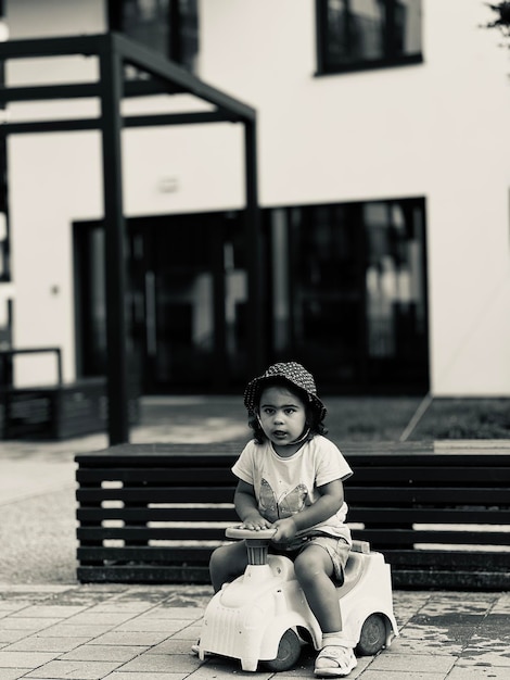 Young woman sitting on street