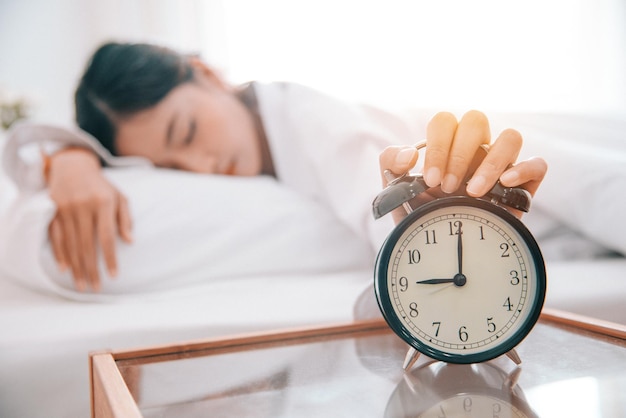 Young woman sleeping on bed at home